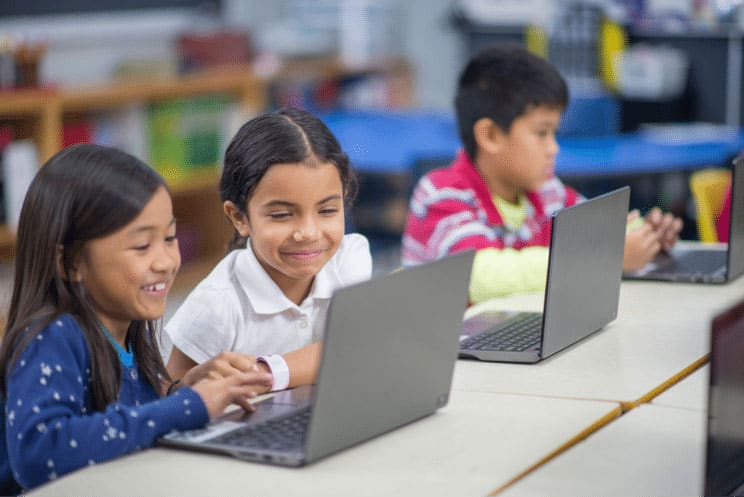children learning in front of a pc